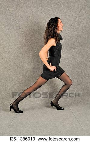Young woman with very long legs View Large Photo Image Stock Photo - Young woman with very long legs. Fotosearch