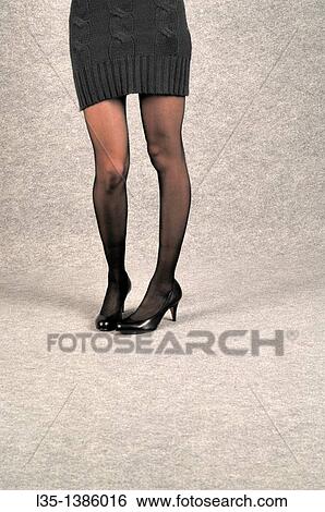Young woman with very long legs View Large Photo Image Stock Photograph - Young woman with very long legs. Fotosearch