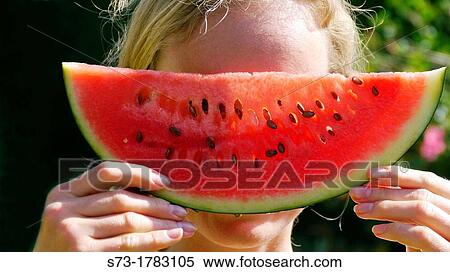 Stock Photography - Young woman with watermelon. Fotosearch