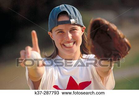 Young woman with winning smile and star quality playing in baseball time View Large Photo Image Stock Image - Young woman with winning smile and star quality playing in baseball time. Fotosearch