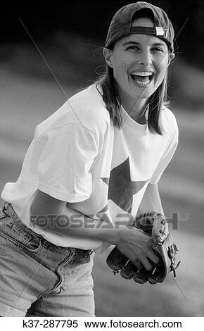 Young woman with winning smile and star quality playing in baseball game View Large Photo Image Stock Photography - Young woman with winning smile and star quality playing in baseball game. Fotosearch