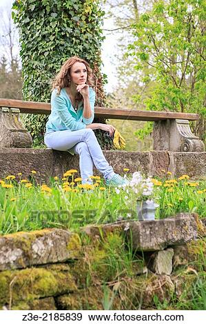 young woman working in the garden, Coburg, Germany. View Large Photo Image Stock Photo - young woman working in the garden, Coburg, Germany.. Fotosearch
