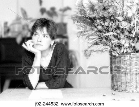 Stock Image - Young woman writing love letter.. Fotosearch