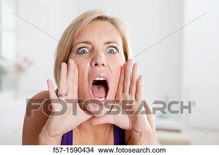 Young woman yelling View Large Photo Image Picture - Young woman yelling. Fotosearch