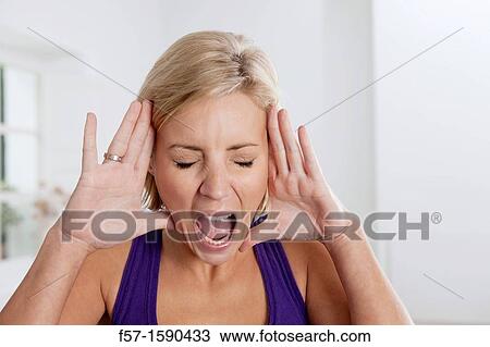 Young woman yelling View Large Photo Image Stock Image - Young woman yelling. Fotosearch