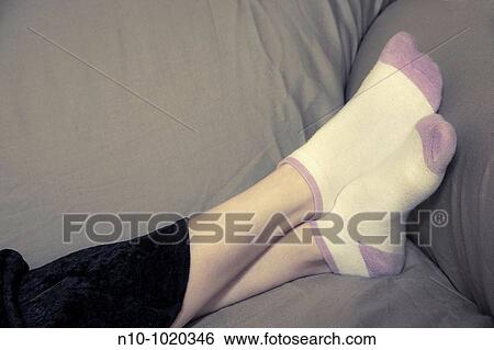 Young woman's feet in socks View Large Photo Image Stock Photograph - Young woman's feet in socks. Fotosearch