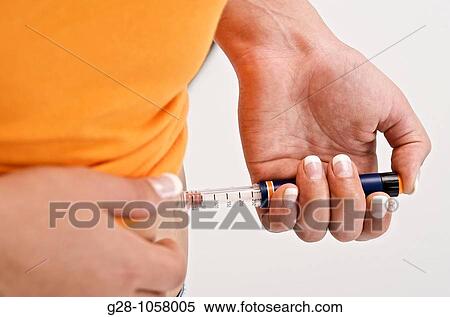young woman's hand injecting insulin against diabetes close up View Large Photo Image Stock Photography - young woman's hand injecting insulin against diabetes close up. Fotosearch