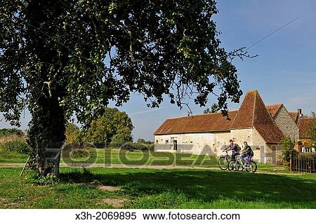 young women cycling around Corbon, Regional Natural Park of Perche, Orne department, Lower Normandy region, France, Western Europe. View Large Photo Image Stock Photography - young women cycling around Corbon, Regional Natural Park of Perche, Orne department, Lower Normandy region, France, Western Europe.. Fotosearch