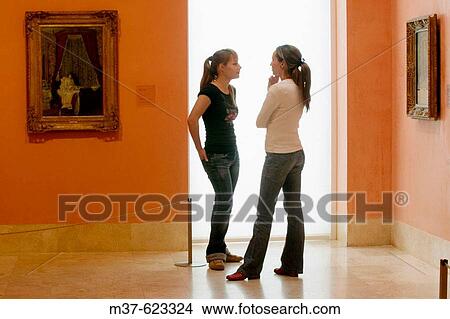 Picture - Young women in art gallery. Fotosearch