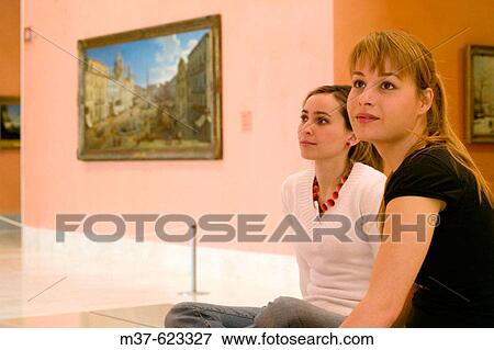 Young women in art gallery View Large Photo Image Stock Photo - Young women in art gallery. Fotosearch