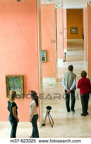 Young women in art gallery View Large Photo Image Stock Photography - Young women in art gallery. Fotosearch