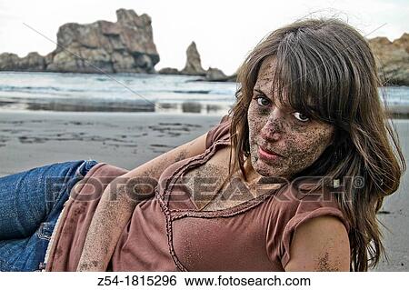 Young women lying down the beach, with sand on her face, El Sablon, Asturias, Spain View Large Photo Image Stock Photograph - Young women lying down the beach, with sand on her face, El Sablon, Asturias, Spain. Fotosearch
