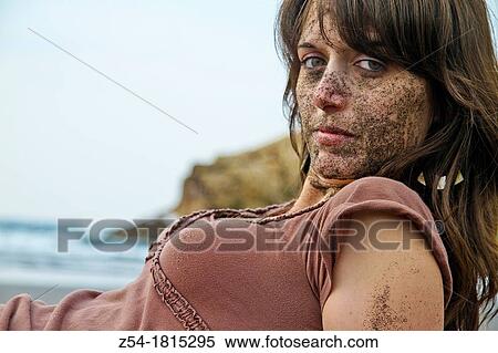 Young women lying down the beach, with sand on her face, El Sablon, Asturias, Spain View Large Photo Image Stock Photography - Young women lying down the beach, with sand on her face, El Sablon, Asturias, Spain. Fotosearch
