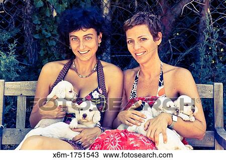 Stock Image - young women with a dog brood. Fotosearch
