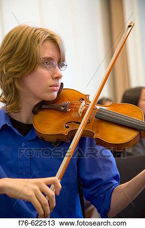 Youth Symphony Orchestra rehearsal, playing the viola. View Large Photo Image Stock Image - Youth Symphony Orchestra rehearsal, playing the viola.. Fotosearch
