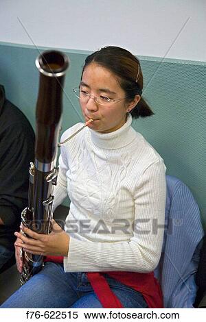 Stock Photography - Youth Symphony Orchestra rehearsal, playing bassoon.. Fotosearch