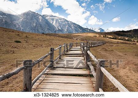 Yulong Xue Shan Mountain range, also known as Jade Dragon Snow Mountain, from Yak Meadow, Lijiang, Yunnan Province, China View Large Photo Image Stock Photography - Yulong Xue Shan Mountain range, also known as Jade Dragon Snow Mountain, from Yak Meadow, Lijiang, Yunnan Province, China. Fotosearch