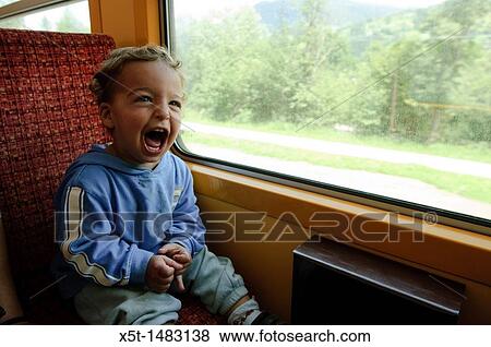 Zillertal, Tyrol, Austria, Steam hauled tourist train on the narrow gauge Zillertalbahn Car interior Excited boy sits by the window View Large Photo Image Stock Photo - Zillertal, Tyrol, Austria, Steam hauled tourist train on the narrow gauge Zillertalbahn Car interior Excited boy sits by the window. Fotosearch