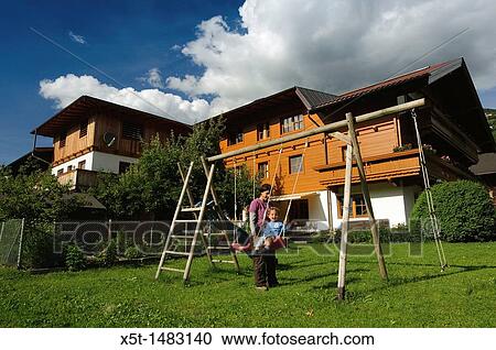 Stock Image - Zillertal, Tyrol, Austria wooden Chalet. Fotosearch