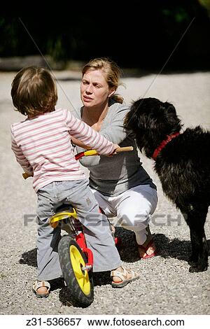 Stock Photo - Zina, Naloen, Bike, Dog. Fotosearch
