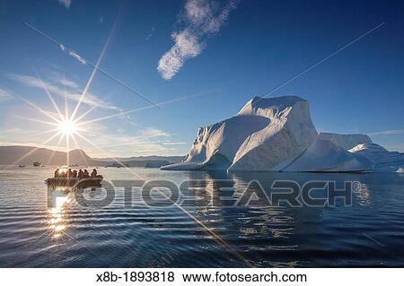 Zodiacs from the Lindblad Expeditions ship National Geographic Explorer amongst grounded icebergs near Rode O Red Island, Scoresbysund, Northeast Greenland View Large Photo Image Stock Photo - Zodiacs from the Lindblad Expeditions ship National Geographic Explorer amongst grounded icebergs near Rode O Red Island, Scoresbysund, Northeast Greenland. Fotosearch