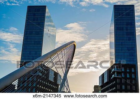 Stock Photography - Zubizuri or Calatrava Bridge and Isozaki Atea Towers. Bilbao, Spain.. Fotosearch