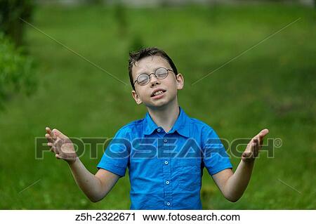 A boy of twelve years in the garden. View Large Photo Image Stock Image - A boy of twelve years in the garden.. Fotosearch