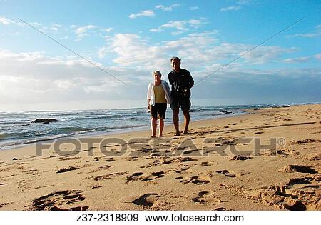 A couple on a beach along the Indian Ocean, the Garden Route, Kwazulu Natal, South Africa View Large Photo Image Stock Photo - A couple on a beach along the Indian Ocean, the Garden Route, Kwazulu Natal, South Africa. Fotosearch