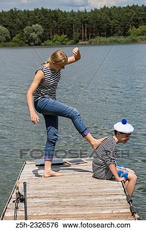 Boy and girl of twelve years in the form of fish sailor udyat. View Large Photo Image Stock Photograph - Boy and girl of twelve years in the form of fish sailor udyat.. Fotosearch