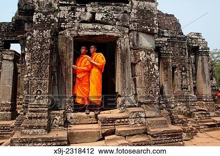 Buddhist monks at Bayon temple, Angkor thom, UNESCO World Heritage Site, Siem Reap, cambodia View Large Photo Image Stock Image - Buddhist monks at Bayon temple, Angkor thom, UNESCO World Heritage Site, Siem Reap, cambodia. Fotosearch