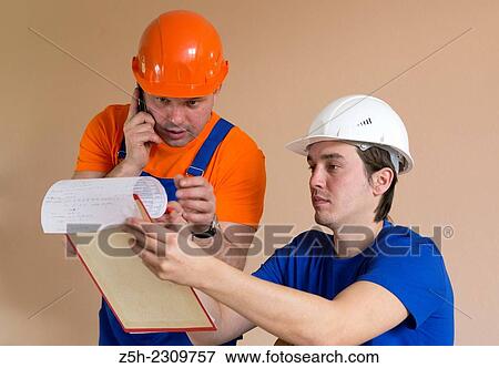 Stock Photo - Builders of the discussion task.. Fotosearch
