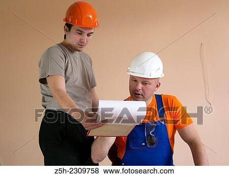 Stock Photo - Builders of the discussion task.. Fotosearch