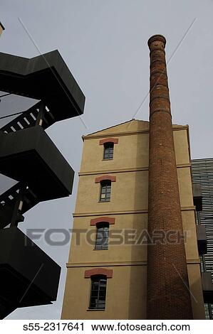 Chimney of old wheat and flour factory Can Gili Vell, Poblenou quarter, Barcelona, Catalonia, Spain. It is situated between streets Ciutat de Granada, Doctor Trueta, Roc Boronat i el passatge Mas de Roda. View Large Photo Image Stock Image - Chimney of old wheat and flour factory Can Gili Vell, Poblenou quarter, Barcelona, Catalonia, Spain. It is situated between streets Ciutat de Granada, Doctor Trueta, Roc Boronat i el passatge Mas de Roda.. Fotosearch