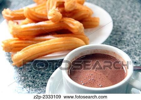 Stock Photo - churros with hot chocolate Spain.. Fotosearch
