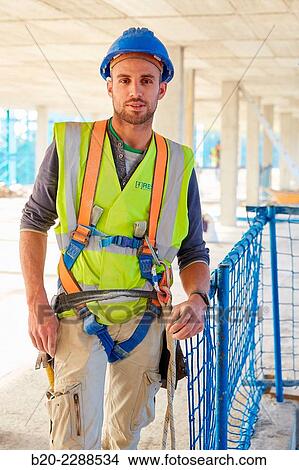 Picture - Construction Worker. Homebuilding. Donostia, San Sebastian, Basque Country, Spain.. Fotosearch