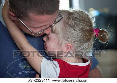 Dad comforting crying daughter age 29 and 5. Zawady Central Poland. View Large Photo Image Stock Image - Dad comforting crying daughter age 29 and 5. Zawady Central Poland.. Fotosearch