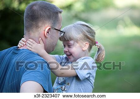 Daughter enjoying a special moment with her father. Zawady Central Poland. View Large Photo Image Stock Photo - Daughter enjoying a special moment with her father. Zawady Central Poland.. Fotosearch