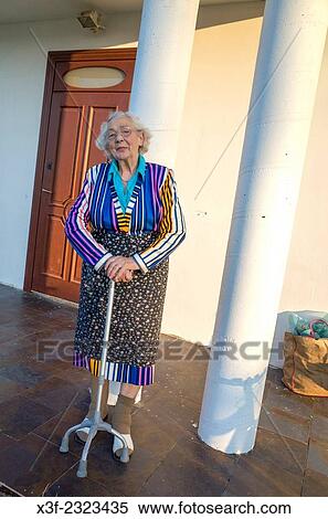 Elderly Polish great grandmother age 88 colorfully dressed on porch of family home. Zawady Central Poland. View Large Photo Image Stock Photography - Elderly Polish great grandmother age 88 colorfully dressed on porch of family home. Zawady Central Poland.. Fotosearch
