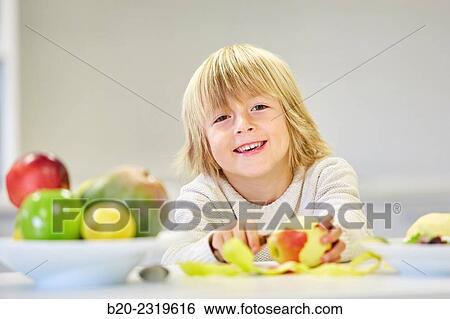 Family in the kitchen. Child. Healthy eating. Healthy growth. Eating an apple. View Large Photo Image Stock Photograph - Family in the kitchen. Child. Healthy eating. Healthy growth. Eating an apple.. Fotosearch