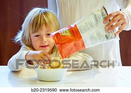 Family in the kitchen. Child. Packaged foods. View Large Photo Image Stock Image - Family in the kitchen. Child. Packaged foods.. Fotosearch