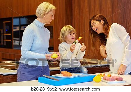 Family in the kitchen. Three generations. Healthy eating. Healthy growth. Cooking fish and vegetable skewer. View Large Photo Image Stock Image - Family in the kitchen. Three generations. Healthy eating. Healthy growth. Cooking fish and vegetable skewer.. Fotosearch