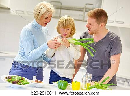 Family in the kitchen. Three generations. Healthy eating. Healthy growth. View Large Photo Image Stock Image - Family in the kitchen. Three generations. Healthy eating. Healthy growth.. Fotosearch