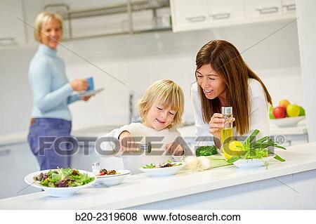 Family in the kitchen. Three generations. Healthy eating. Healthy growth. Making vegetable salad. View Large Photo Image Stock Photo - Family in the kitchen. Three generations. Healthy eating. Healthy growth. Making vegetable salad.. Fotosearch