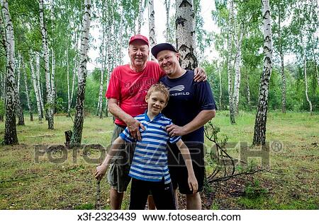 Family of three generations enjoying a moment in the Polish woods. Zawady Central Poland. View Large Photo Image Stock Photo - Family of three generations enjoying a moment in the Polish woods. Zawady Central Poland.. Fotosearch