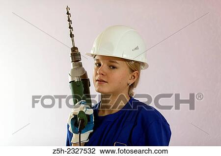 Girl in working clothes with construction tools. View Large Photo Image Stock Image - Girl in working clothes with construction tools.. Fotosearch