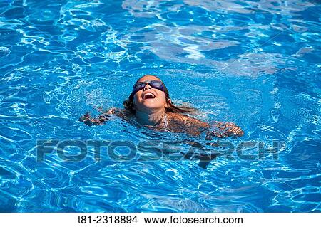 girl jumping into the pool View Large Photo Image Picture - girl jumping into the pool. Fotosearch