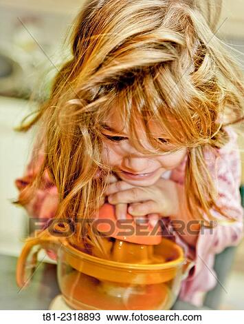 Girl squeezing oranges in Valencia, Spain. View Large Photo Image Stock Image - Girl squeezing oranges in Valencia, Spain.. Fotosearch