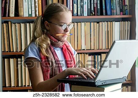 Girl with a computer in the reading room. View Large Photo Image Stock Image - Girl with a computer in the reading room.. Fotosearch