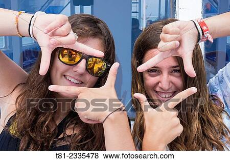 Girls looking frame. Peniscola, Valencian Community, Spain. View Large Photo Image Stock Photo - Girls looking frame. Peniscola, Valencian Community, Spain.. Fotosearch