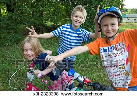 Happy children giving their grandfather photographer Steve Skjold a rousing Polish welcome. Zawady Central Poland. View Large Photo Image Stock Photo - Happy children giving their grandfather photographer Steve Skjold a rousing Polish welcome. Zawady Central Poland.. Fotosearch